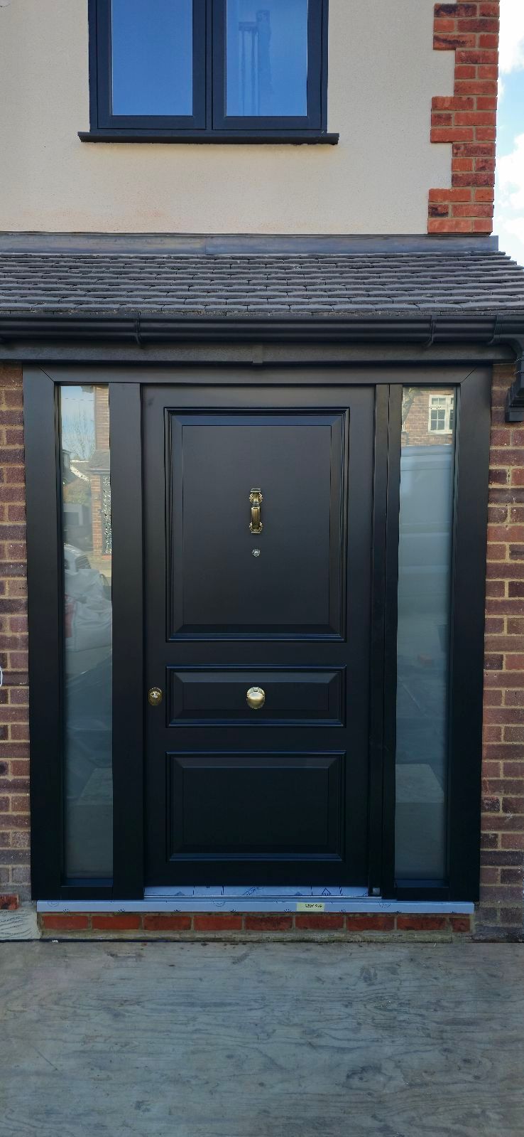 Painted solid panel front door installed on an Essex home — project 1