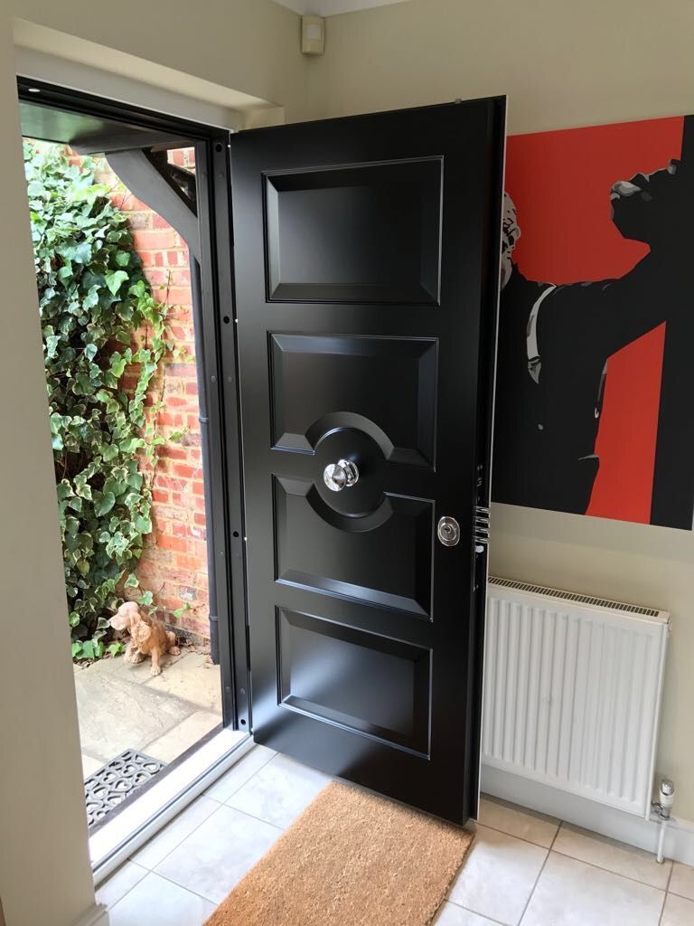Painted solid panel front door installed on an Essex home — project 2